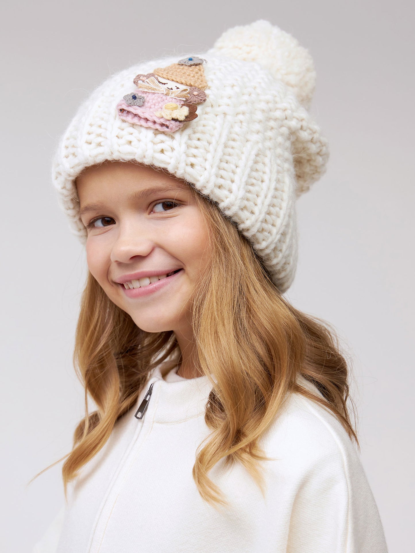 10036 Girls’ Warm Winter Hat with Pom-Pom & Knitted Doll Design – Baby Alpaca & Wool Blend | Sizes 3–5 Years | Cotton Lining